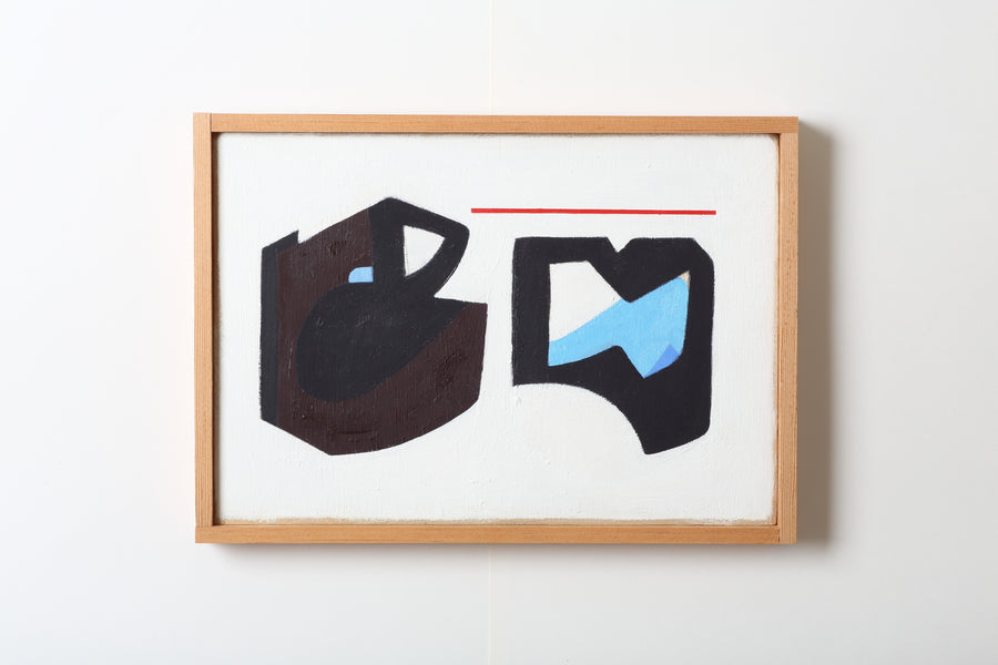 Framed abstract artwork with black and blue shapes on a white background